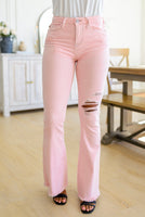 Feminine Flair Mid Rise Distressed Flares in Pastel Pink